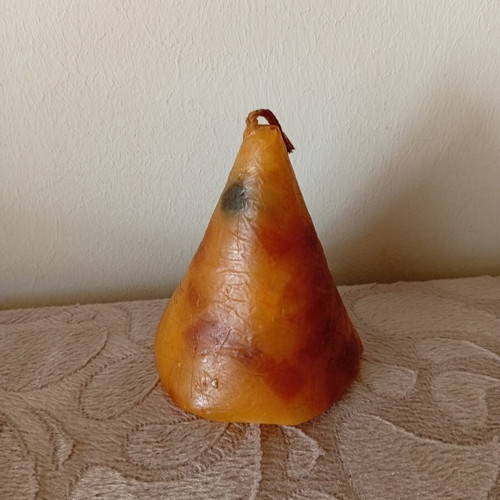 Cone candle used, unlit with dark wick