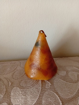 Cone candle used, unlit with dark wick