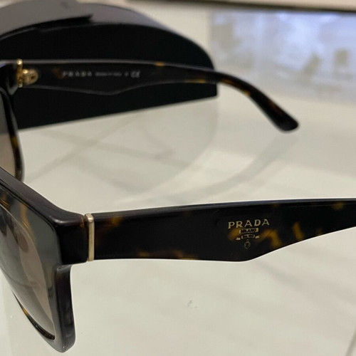 Prada SPR 24Q sunglasses used, brown tortoise design with case