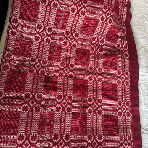 Woven blanket like new with deep red color and satin trim 190x220