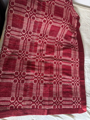 Woven blanket like new with deep red color and satin trim 190x220