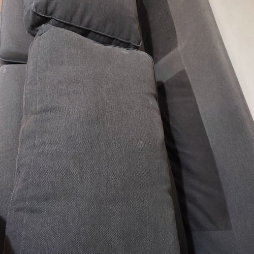 Two-seater fabric sofa used, dark gray color with visible marks