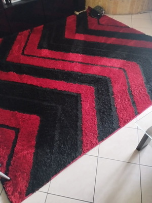 Rug used, red and black pattern