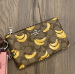 Coach Corner Zip Trio wallet set in signature canvas with fruit print