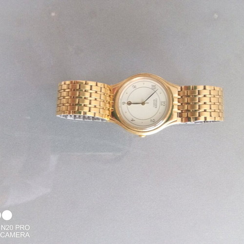 Citizen Qourtz wristwatch used, slim with gold bracelet and white dial