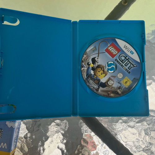 Nintendo Wii U console used with game cartridges and cables