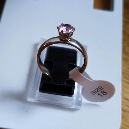Stainless steel solitaire ring new with purple stone, size 18