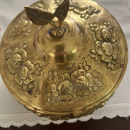 Vintage brass jewelry box used with embossed floral motifs