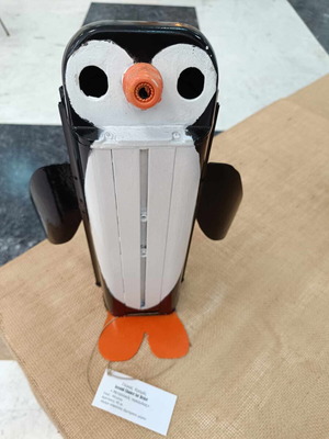 Decorative penguin like new made from recycled CCTV camera