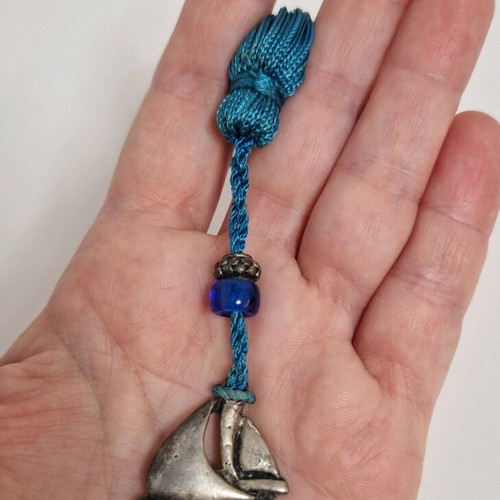 Gouri boat from Mati with blue bead like new