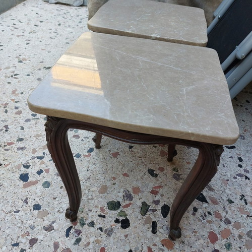 Vintage side tables pair with natural marble used