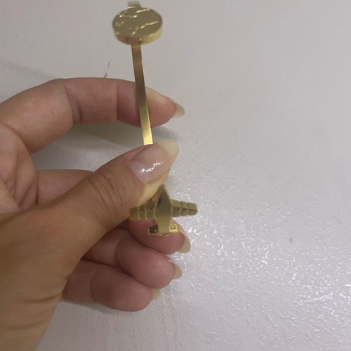 Gold-tone bracelet with travel design