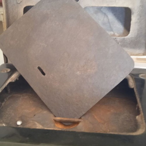 Cast iron stove used for briquettes and wood