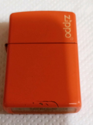 Zippo lighter used orange color with Zippo logo