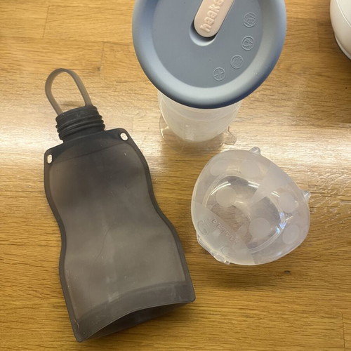 Haakaa breast pump set like new with milk storage bag