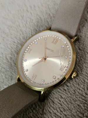 Wristwatch used, beige, with strap and glass damage