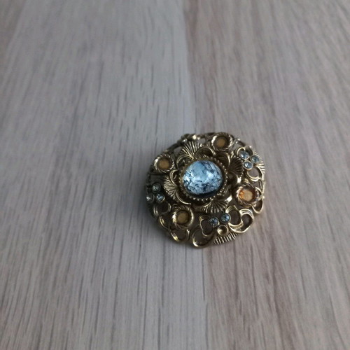Traditional old brooch with stone