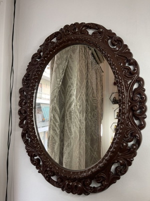Vintage oval wall mirror with embossed frame