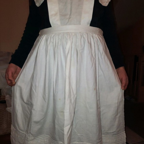 Traditional white kitchen apron with shoulders, buttons at back