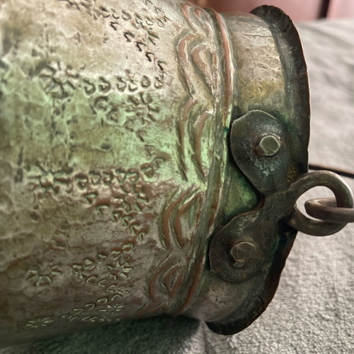 Handmade copper cauldron used with hammered texture and designs