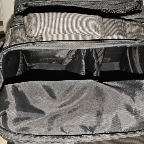 Nikon camera bag like new with shoulder strap and multiple compartments