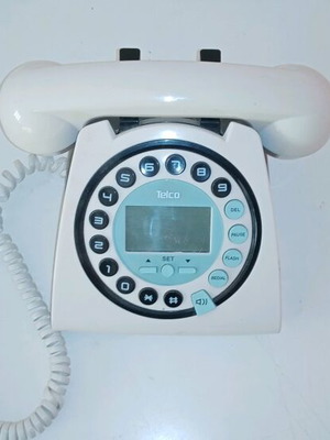 Landline phone used, white, wired, unknown functionality