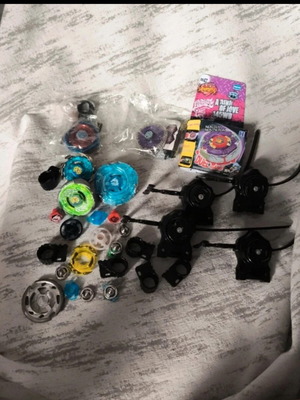 Beyblade collection like new with sealed tops and launchers