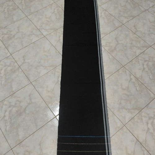 Traditional cotton fabric on loom, new, black with gray stripes and fringes