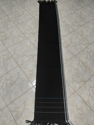 Traditional cotton fabric on loom, new, black with gray stripes and fringes