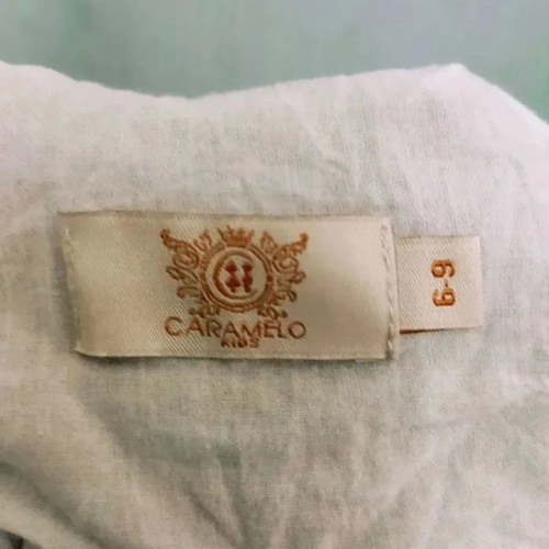 Caramelo kids romper used for 6-9 months with white embroidered details