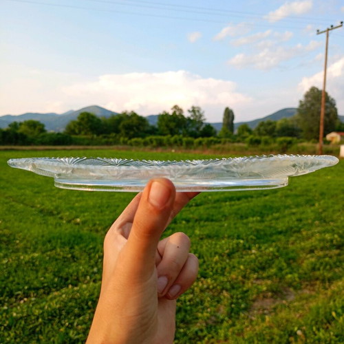 Glass serving plate unused with carved design