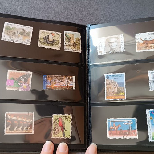 Stamp album with 120 stamps like new, Greece Australia Cyprus Germany America Canada