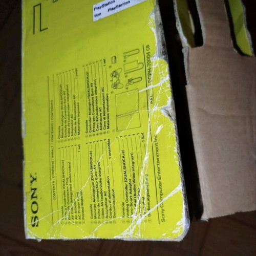 PlayStation 2 console with original controller, memory card and 2 games