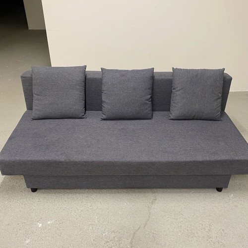 Three-seater sofa bed like new with storage space and 3 cushions
