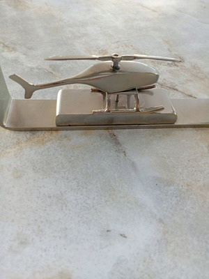 Decorative metal helicopter used in frame