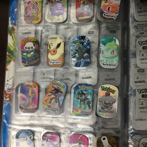 Pokémon album with metal tags used