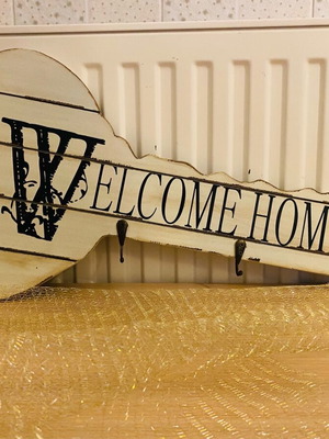 Key-shaped entry coat rack used with three hooks