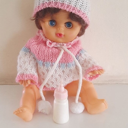 Vintage plastic baby doll from the 70s used with handmade sweater and hat