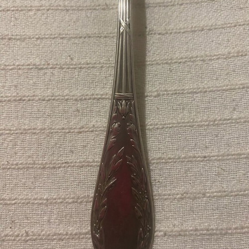 Vintage silver-plated food fork used with embossed decoration