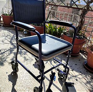 Αναπηρικό καροτσάκι με τουαλέτα αχρησιμοποίητο.