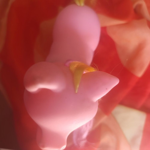Large pink pony toy with colorful mane and tail