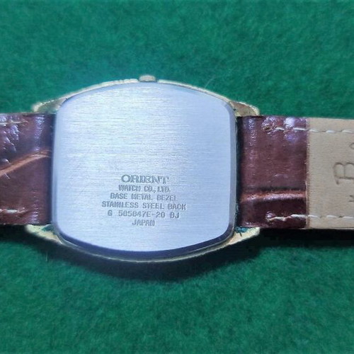 Orient VX wristwatch like new, gold color, leather strap