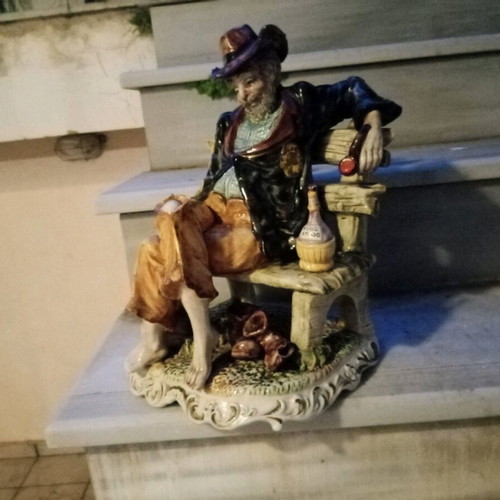 Italian porcelain vintage figure of old man with wine jug and pipe used