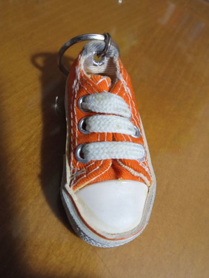 Keychain orange with sports shoe design like new