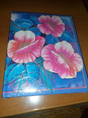 Photo album with flowers in sealed plastic, new