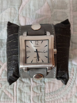 Nemesis wristwatch like new, analog with gray leather strap and silver dial