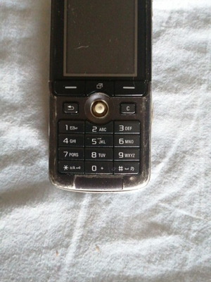 Sony Ericsson mobile phone used, missing back cover