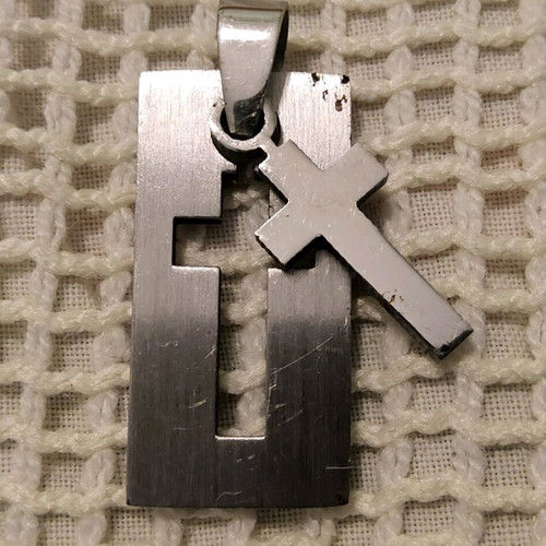Pendant with steel cross like new, silver color