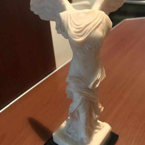 Nike of Samothrace alabaster figurine with minimal black base like new