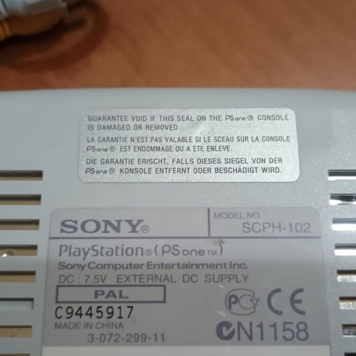 PSone slim console with third-party memory card and controller